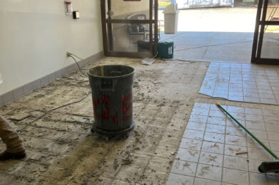 Kuna Library main entryway with tile floor demolition underway