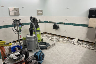 Womens Restroom with Floor and Bottom Row of Tile Demolished